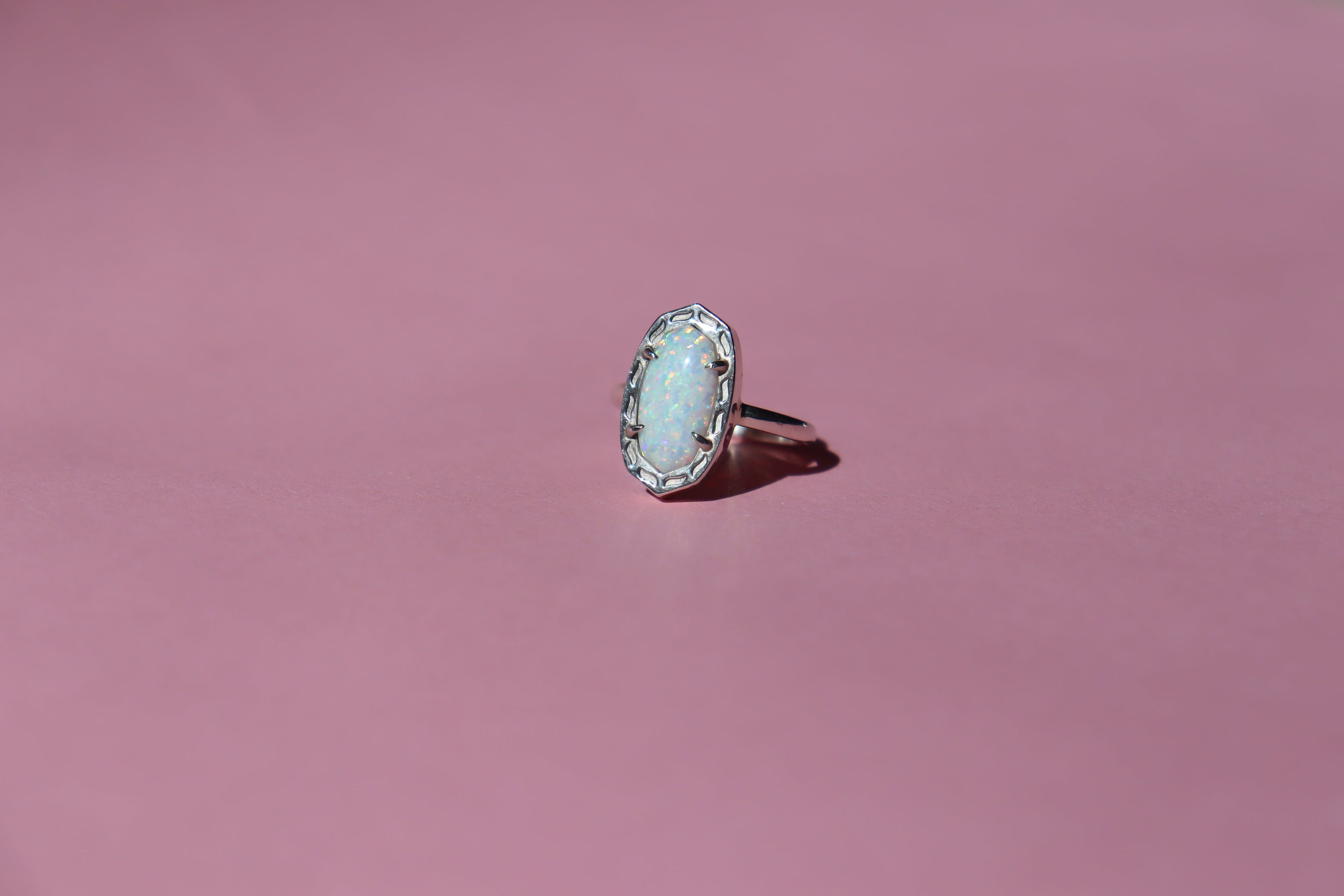 Silver ring with lab created opal