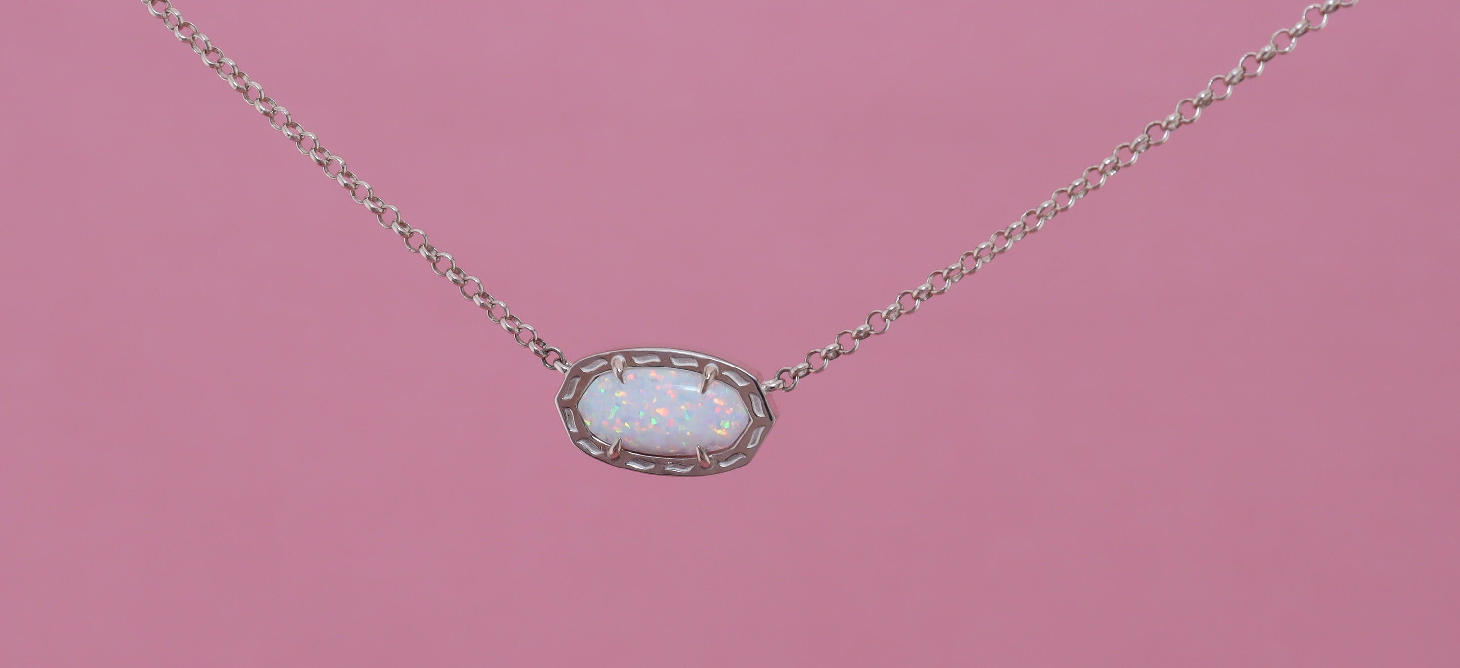 Necklace with a white stone set in pendant on a light white background